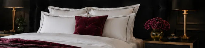 Boutique hotel bed with layered cushions